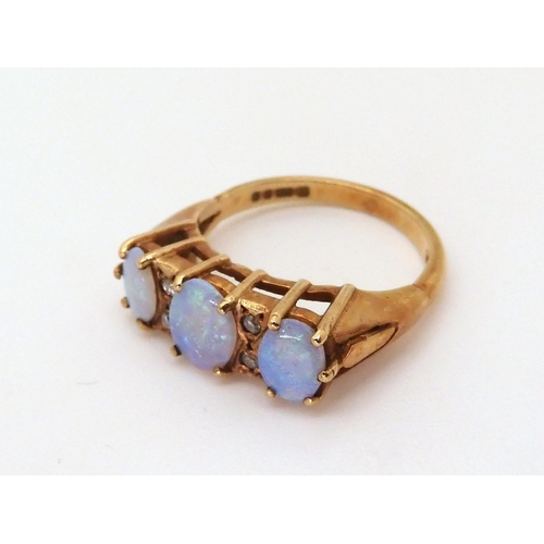 625 - A 9ct gold opal and diamond ring, size M, weight 3.4gms