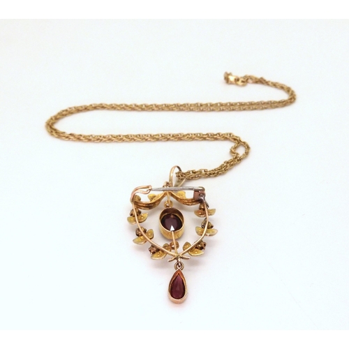 631 - A 9ct gold Edwardian garnet and pearl pendant, length with bail 4.2cm, on a 9ct gold rope chain leng... 