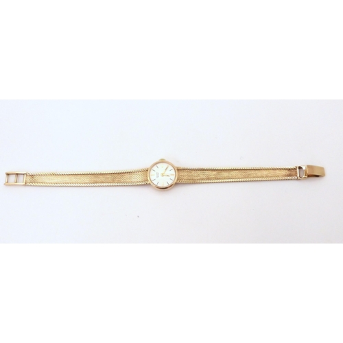 644 - A 9ct gold ladies Record De Luxe wristwatch with integral strap, weight including mechanism 21.5gms