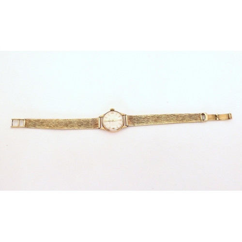 666 - A 9ct gold ladies Omega watch with 9ct woven strap, weight without mechanism 17.7gms, with original ... 