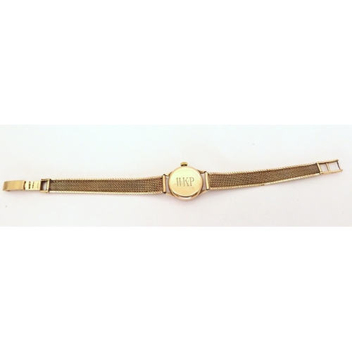 666 - A 9ct gold ladies Omega watch with 9ct woven strap, weight without mechanism 17.7gms, with original ... 