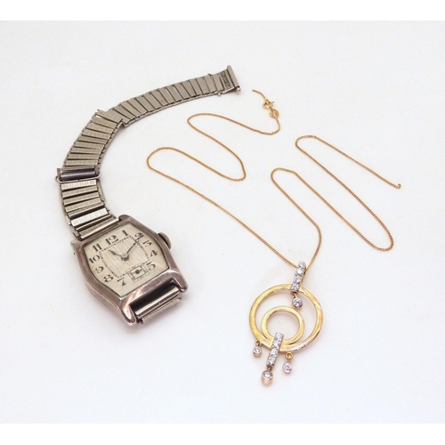 675 - A 9ct gold pendant and chain set with cubic zircona, weight 3.2gms, together with a silver cased Swi... 