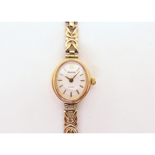 685 - A 9ct gold ladies watch, weight with mechanism 8.5gms, a string of pearls with a 9ct garnet and pear... 