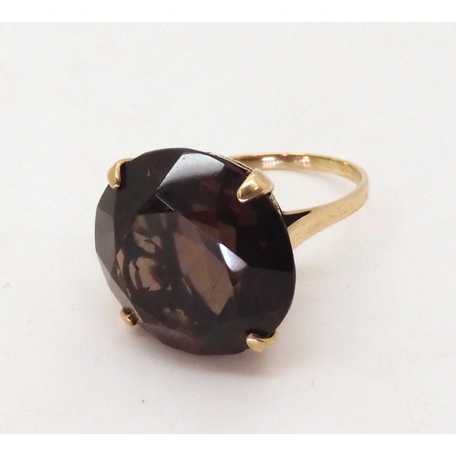 695 - A retro large smoky quartz ring, size R1/2, weight 9gms