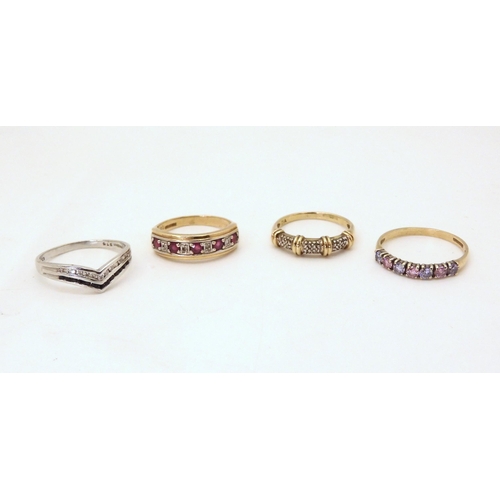 708 - Four 9ct gold gem set rings, diamond accent, size N1/2, 'V'shape cz set Q, ruby and diamond accent, ... 