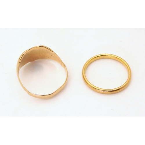 711 - A 22ct gold wedding ring, size N, weight 2.6gms, together with an 18ct gold signet ring, size R1/2, ... 