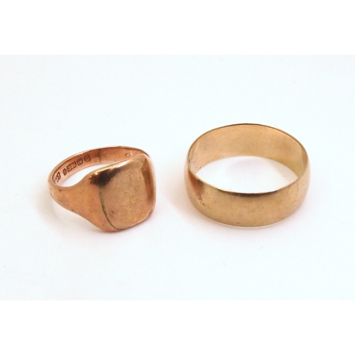 715 - A 9ct wide wedding ring, size X1/2, and a 9ct rose gold signet ring, size O, weight together 10.6gms