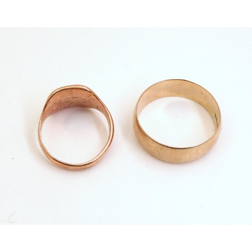 715 - A 9ct wide wedding ring, size X1/2, and a 9ct rose gold signet ring, size O, weight together 10.6gms