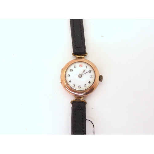 720 - A 9ct gold ladies watch with Arabic dial, leather strap, length 21cm, a yellow metal Maltese Cross b... 