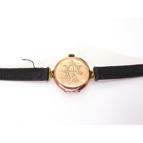 720 - A 9ct gold ladies watch with Arabic dial, leather strap, length 21cm, a yellow metal Maltese Cross b... 