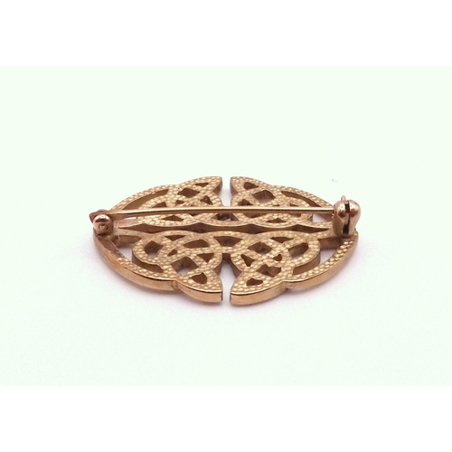 724 - A 9ct gold Art and Craft inspired bracelet, length 18.5cm, together with a 9ct gold knotwork brooch,... 