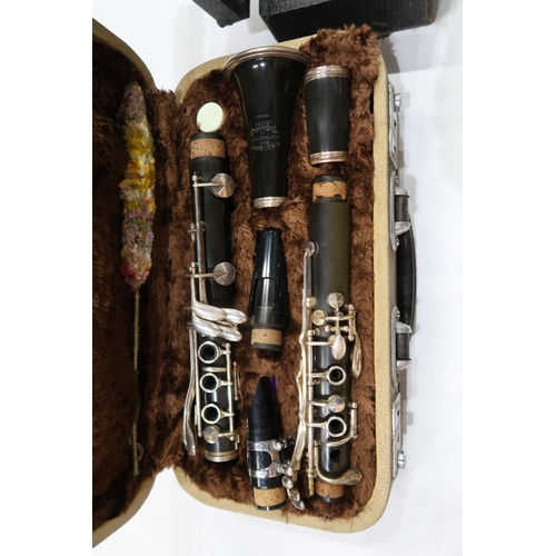 495 - DORE PARIS WHITE METAL CLARINET together with a F. BUISSON CLARINET and a YAMAHA YCL-26 CLARINET (3)