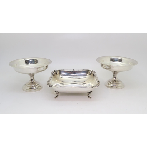 384A - A silver rectangular dish, by Barker Brothers Ltd, Birmingham, and a pair of weighted silver footed ... 