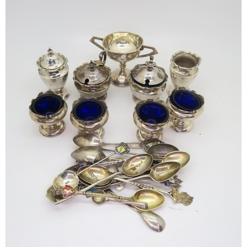 384B - A collection of silver including a four piece cruet set, by Deakin & Sons, Chester, four open si... 