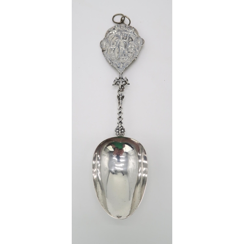 2474 - A DUTCH SILVER SPOONwith a twisting handle and a cast terminal with decoration of a figure of Justic... 