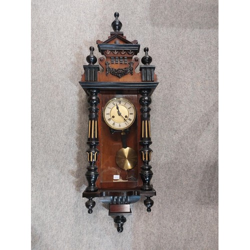 260 - A black slate mantle clock of classical form and a wooden wall clock