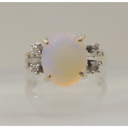 2834 - AN OPAL AND DIAMOND RINGmounted throughout in 18ct white gold, the oval opal is approx 11.3mm x 9.4m... 