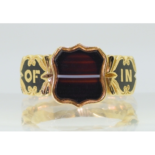 2704 - AN AGATE MOURNING RINGwith shield shaped black & white banded agate, the heavy weight shank with... 