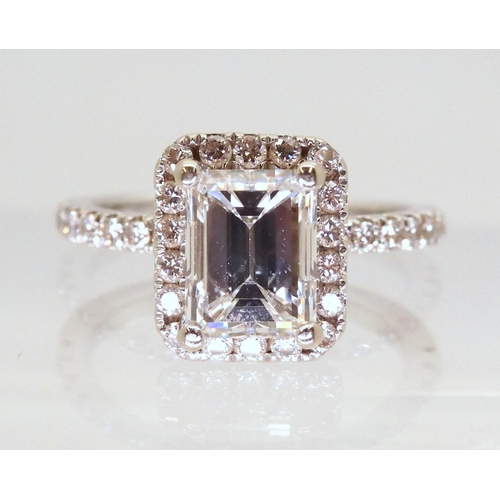 2714 - A 14K WHITE GOLD SUBSTANTIAL DIAMOND RINGset with an estimated approx 1.40ct step cut diamond, with ... 