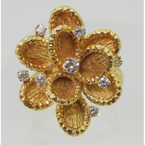 2744 - A VINTAGE STATEMENT RINGthe large multi-petal flower is made in 18ct gold with London hallmarks for ... 