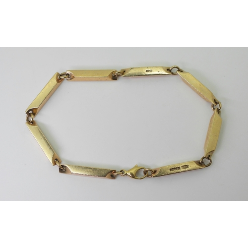 2755 - A RETRO 9CT GOLD BRACELETdesigned and made by Glasgow jeweller Eric Smith, the baton link bracelet h... 