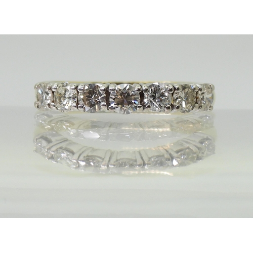 2779 - A HALF ETERNITY RINGmounted in 18ct yellow and white gold and set with estimated approx 1ct of brill... 