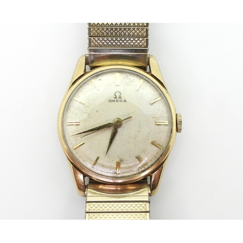 2925 - A GENTS 9CT GOLD OMEGAthe silvered dial has gold baton numerals and dauphin hands, the movement is s... 