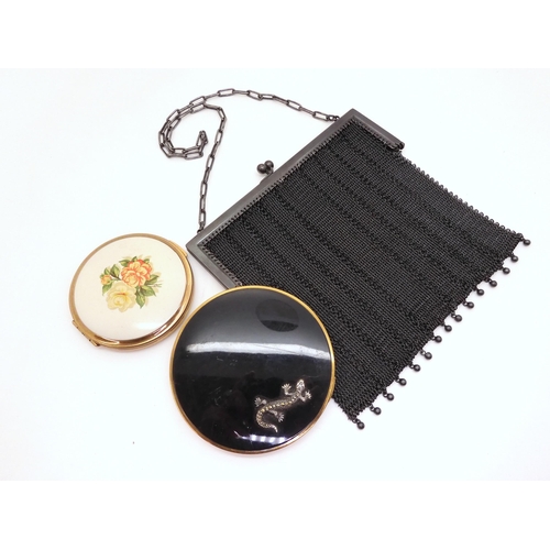 886 - A French Gunmetal mesh purse, A Vogue Vanities compact with a Marcasite set lizard detail and an unu... 