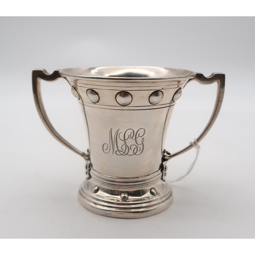 352 - An Edwardian silver twin handled cup, by Wakely & Wheeler, London 1906, engraved with an armoria... 