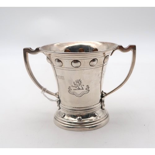 352 - An Edwardian silver twin handled cup, by Wakely & Wheeler, London 1906, engraved with an armoria... 