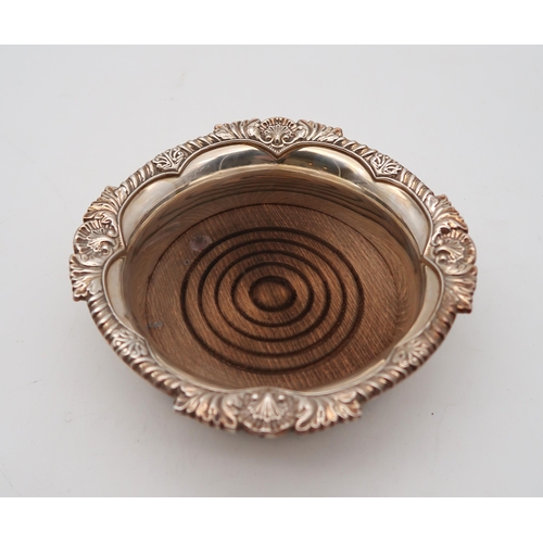 356 - An Elizabeth II silver wine coaster, by Mappin & Webb, Sheffield, with a gadrooned shell border,... 