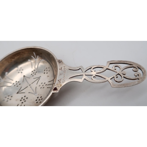 359 - A silver strainer, by Mappin & Webb, London, a small silver quaich, by C T Burrows, Birmingham, ... 