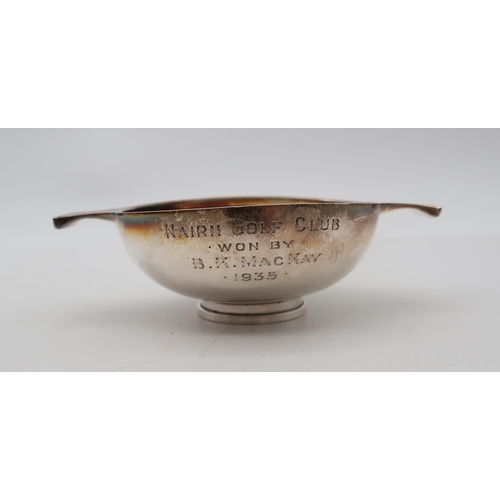 359 - A silver strainer, by Mappin & Webb, London, a small silver quaich, by C T Burrows, Birmingham, ... 