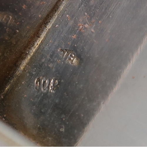 368 - A German silver vanity case, the lid enamelled with a courting scene, the body with engraved scrolli... 