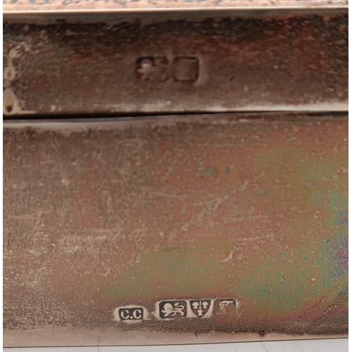 373 - A silver cigarette box, by Cohen & Charles, Chester, 16.5 x 9cm, and a silver plated hip flask (... 