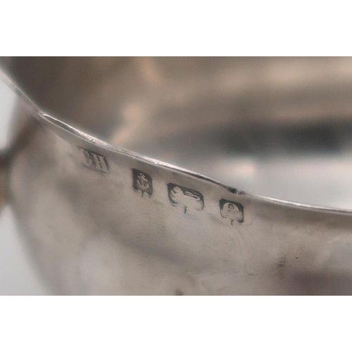 387 - A cased silver caster (plastic filled), Sheffield, and a silver George III style silver sauce boat, ... 
