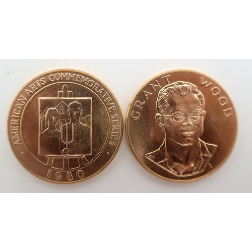 420 - AMERICAN ARTS COMMEMORATIVE MEDALLIONS Two 1980 Grant Wood One Ounce Gold Medals.The obverse design ... 