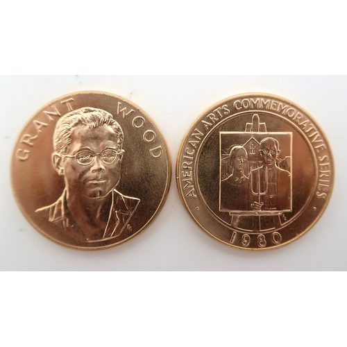 420 - AMERICAN ARTS COMMEMORATIVE MEDALLIONS Two 1980 Grant Wood One Ounce Gold Medals.The obverse design ... 