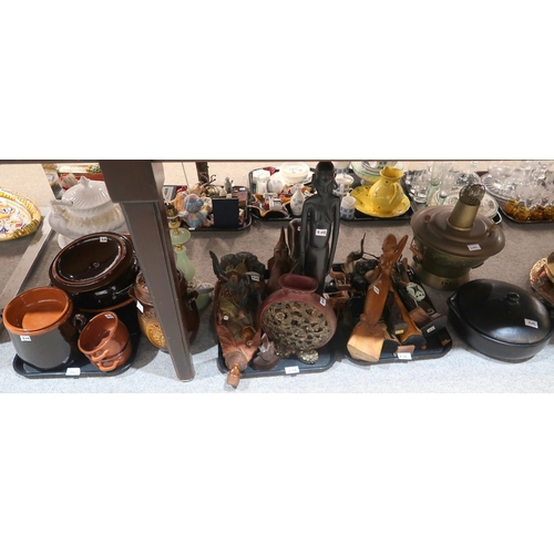 202 - A collection of African figures in wood and resin, brown glazed pottery etc