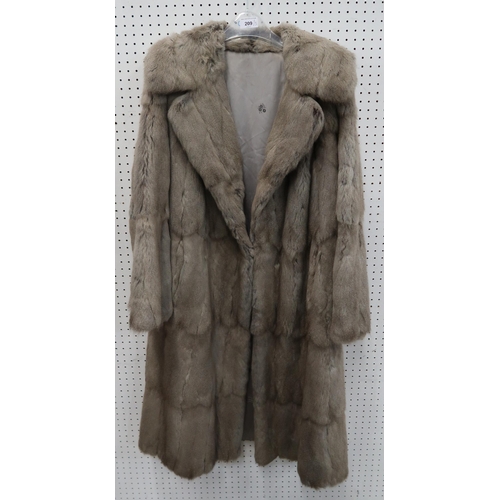 209 - A pale grey fur coat, possibly chinchilla, a long brown fur coat together with a Copland and Lye Ltd... 