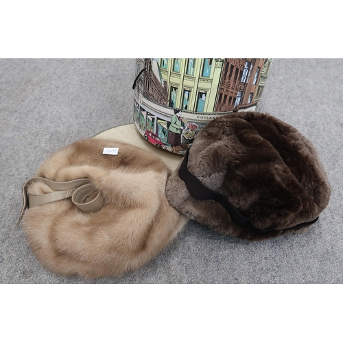 209 - A pale grey fur coat, possibly chinchilla, a long brown fur coat together with a Copland and Lye Ltd... 