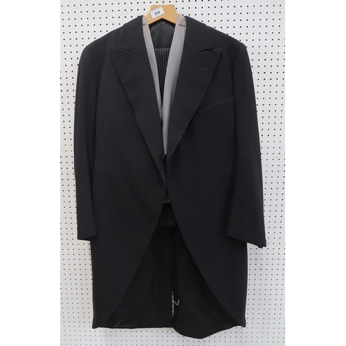 210 - A gentleman's mourning suit comprising black jacket, grey stripe trousers, black and a grey waistcoa... 