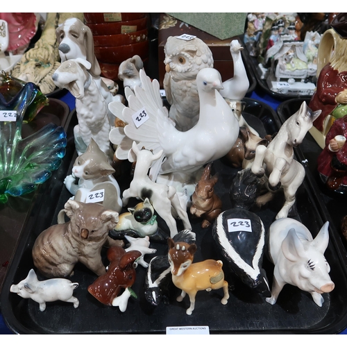 223 - A collection of animal and bird figures including Beswick skunk, Babycham fawn, Koala, pig, Nao dogs... 