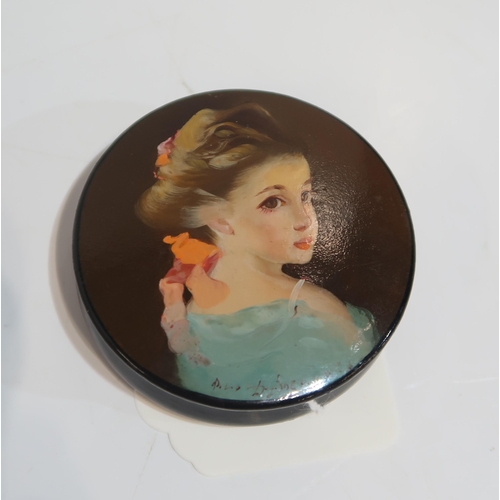 265 - A Russian circular box, painted with the portrait of a child, a Herend green dolphin, a red fish, a ... 
