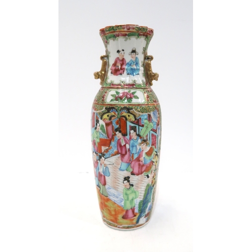 275 - A Chinese famille rose baluster vase, the body fluted, with a shaped rim and applied gilt handles, d... 
