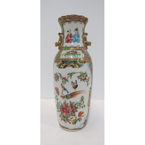 275 - A Chinese famille rose baluster vase, the body fluted, with a shaped rim and applied gilt handles, d... 