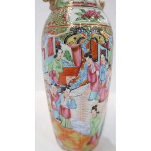 275 - A Chinese famille rose baluster vase, the body fluted, with a shaped rim and applied gilt handles, d... 