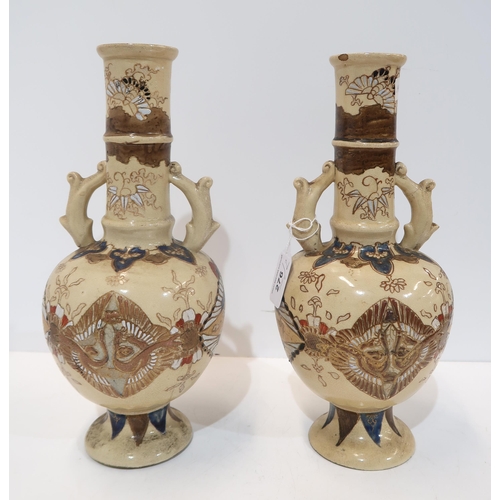 276 - A pair of Japanese stoneware vases, of bottle form, decorated with birds and foliage, 31cm high (2)