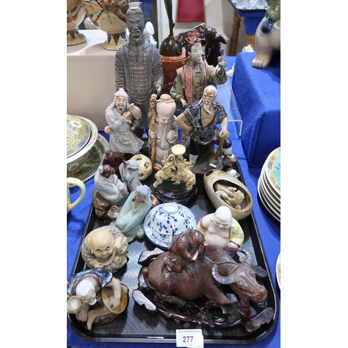 277 - A collection of ceramics including Chinese figures of scholars and fishermen, a Buddha, a carved woo... 