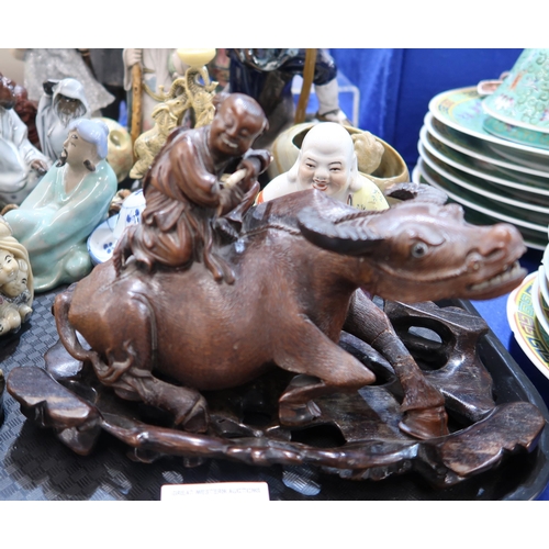 277 - A collection of ceramics including Chinese figures of scholars and fishermen, a Buddha, a carved woo... 